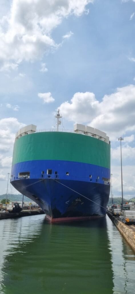Large cargo vessel bow entering a lock chamber on the Panama Canal